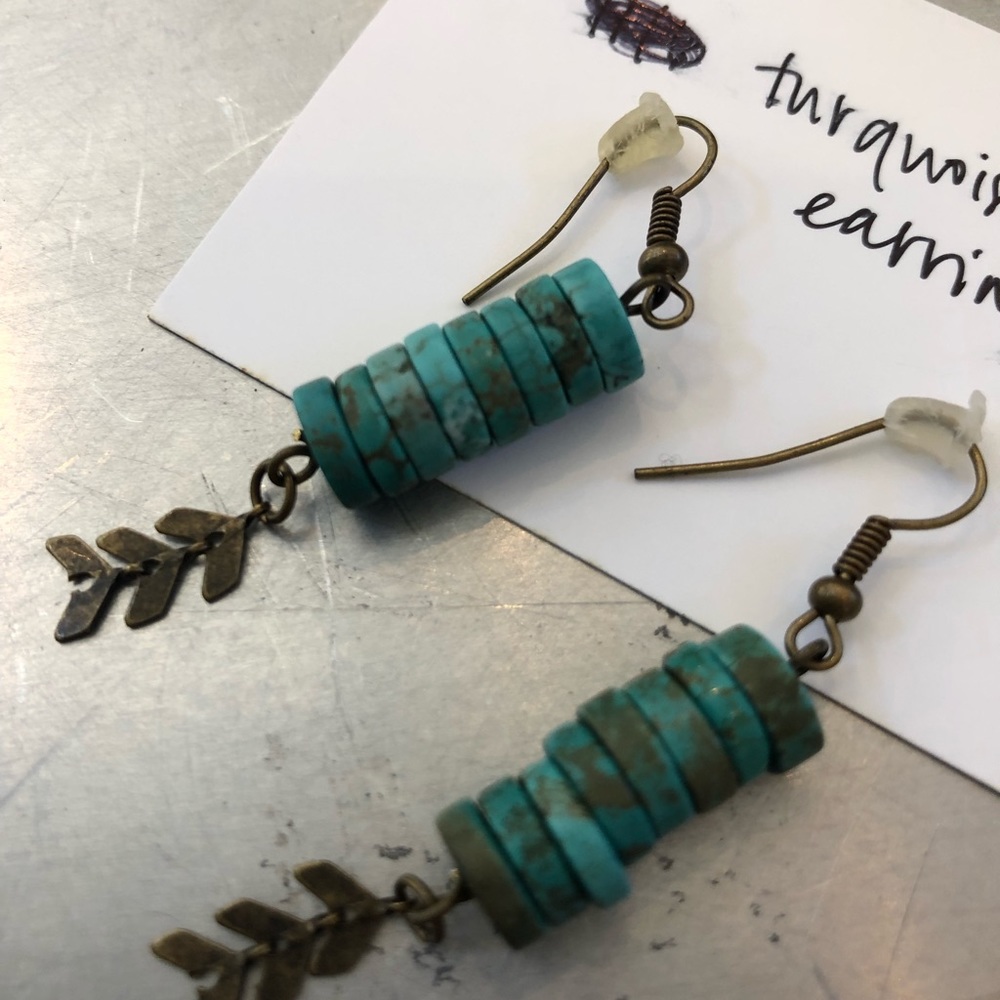 Turquoise and brass earrings.